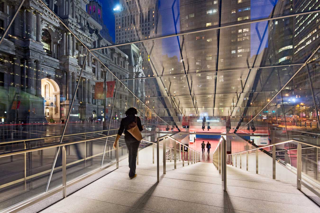 <p>Self-cleaning, shatterproof glass, and graffiti-resistant film help to protect and maintain the entryway pavilions to underground transit. <br><small>&copy; James Ewing Photography</small></p>