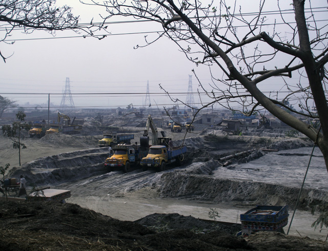 A sand depot reflects the volume of sandfilling operations near Dhaka.
