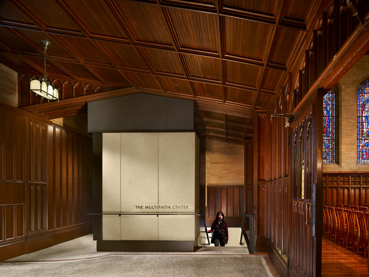 <p>An elevator bay added in the narthex respects the existing ornate wood through the use of Kasota stone and bronze details and makes the Multifaith Center below ground more accessible. <br><small>&copy; Halkin Photography LLC</small></p>